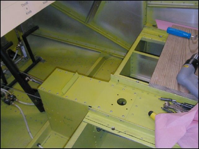 Deburr, clean, prime, and rivet the torque tunnel cover.