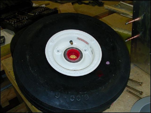 insert the valve stem through the hole in the rim.