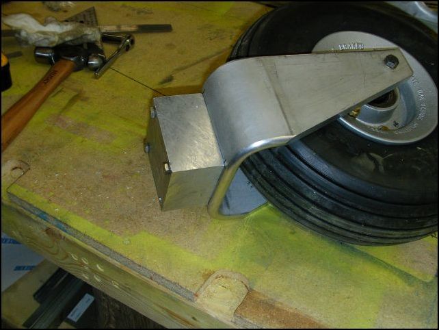 I did not like the way the aircraft sat nose down so I installed a 2 inch block between the nose strut and the nose wheel.