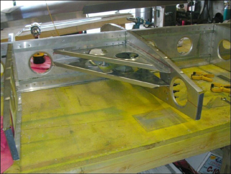 Drill and cleco the aileron bellcrank assembly to the spar.