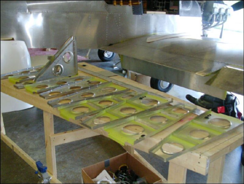 Deburr, clean, and prime all ribs and wing spar.