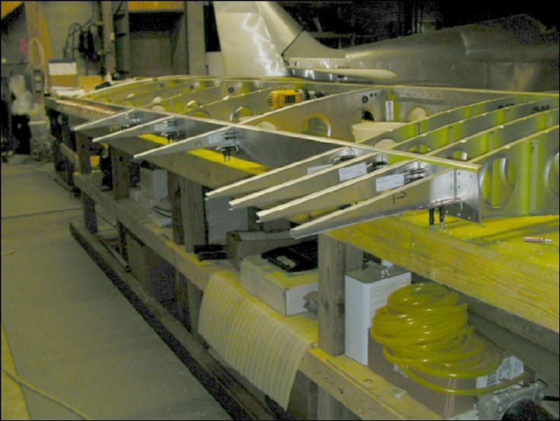 Drill and cleco riblets to rear channel over flap area