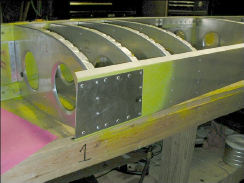 Install solid rivets in front wing pickup