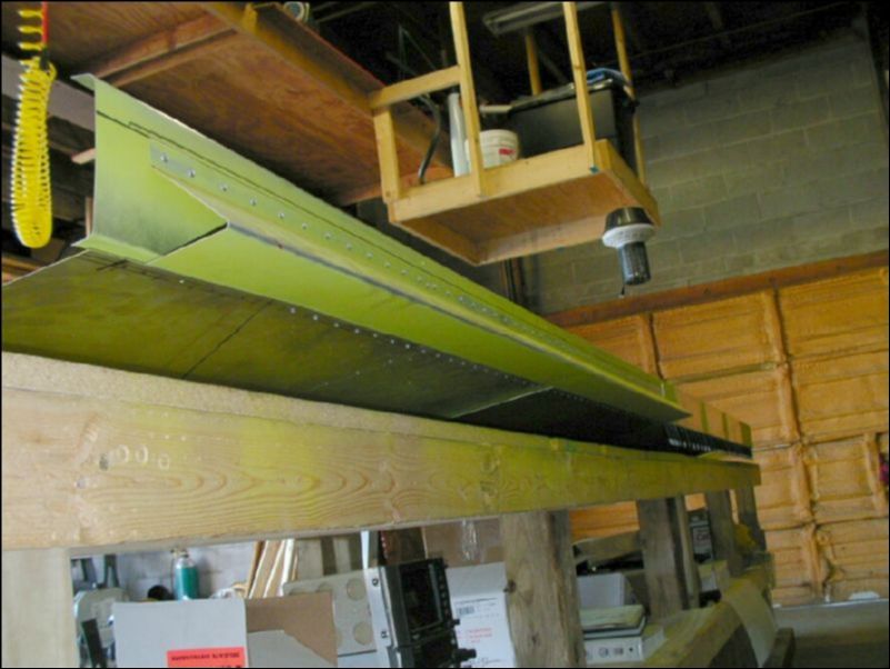 Deburr, clean, prime, and rivet the aileron support channel.