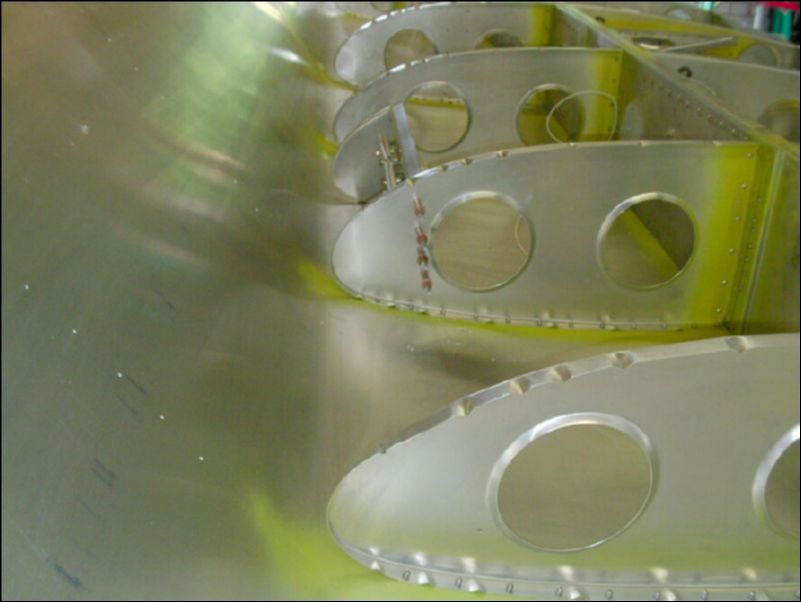 Drill and cleco the landing light assembly in position.