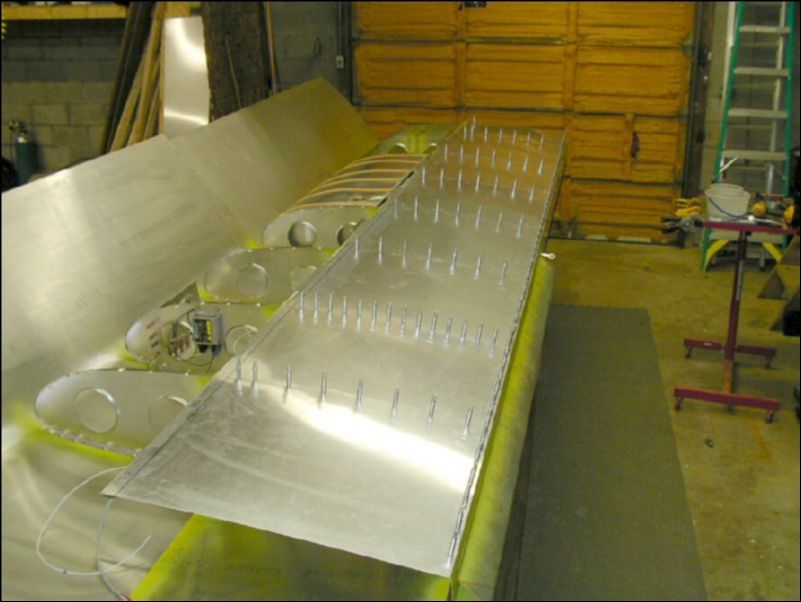 Drill and cleco top rear skins.