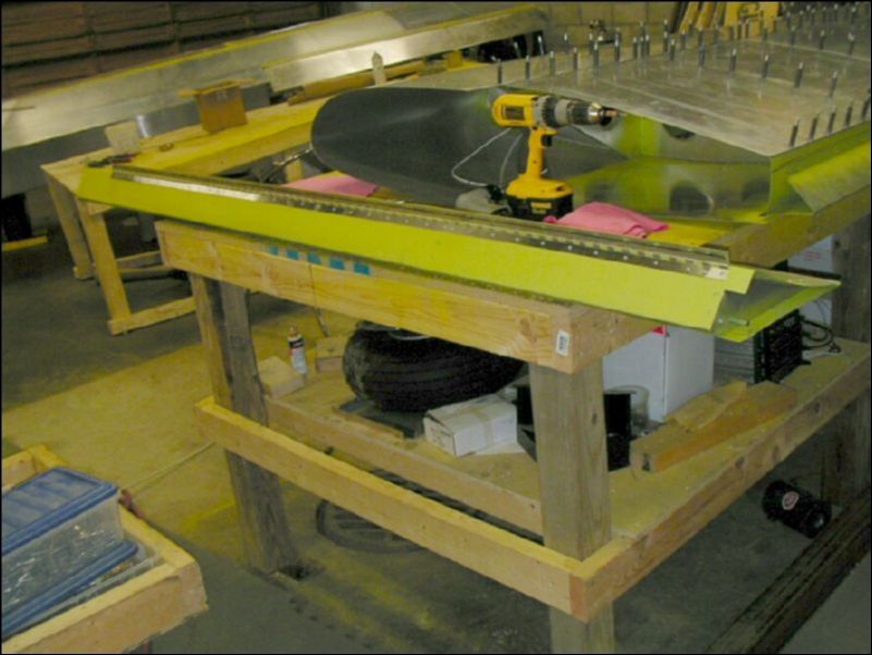 Drill, cleco, deburr, clean, prime, and rivet the aileron hinge to the aileron.