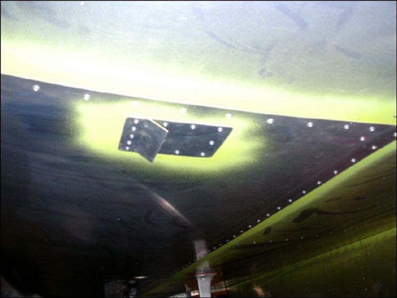 Install the fuel tank vent deflector.