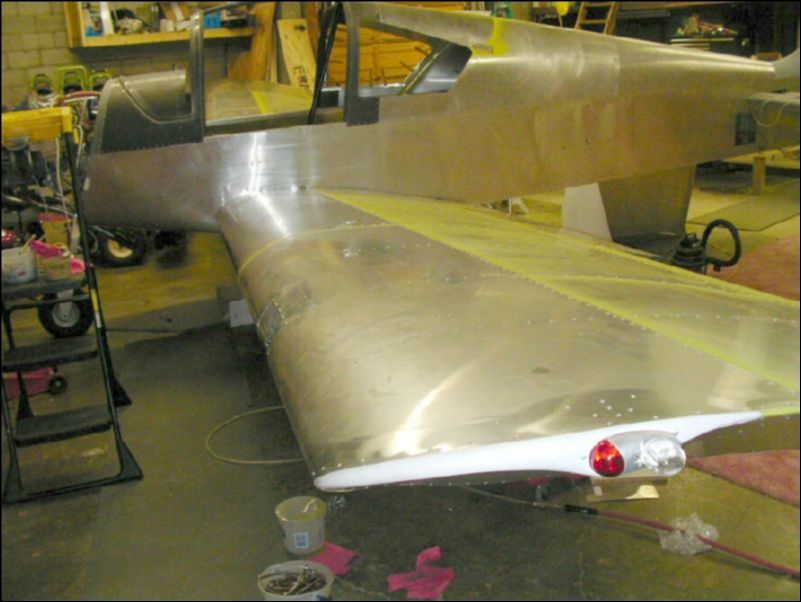 Rivet skin over fuel tank 