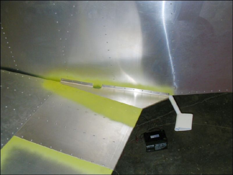 Rivet the flap fairings to the fuselage.