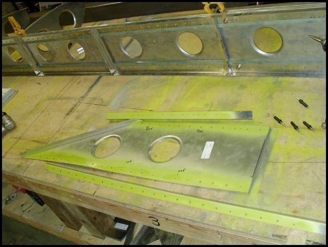 Deburr, clean, and prime the upper and lower spar cap angles and wing tip extension.