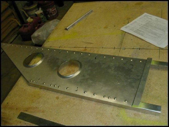 Rivet the upper and lower spar cap angles to the wing tip extension.  I used solid rivets AD6 but the drawings show that you can use A5 rivets.