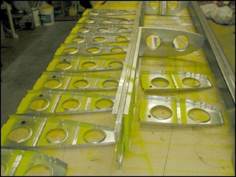 Deburr, clean, and prime all ribs and wing spar