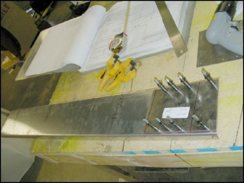 Position, drill and cleco the front channel doubler (20-V-9-3) to the front channel (20-V-9-2).  Trim the end of the front channel to be flush with the doubler's angle.