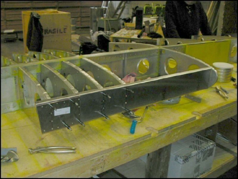 Mark rivet locations as per drawings for the front channel, drill and cleco the front channel to the nose ribs.  Install an L on the side of nose rib 5 to connect the channel to that rib.