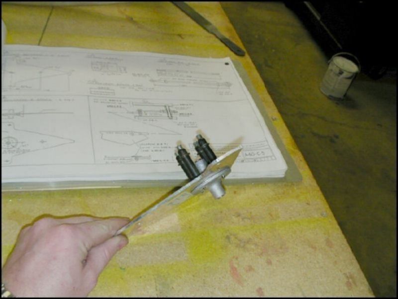 Another image of the bellcrank spools clecoed to the bellcrank.