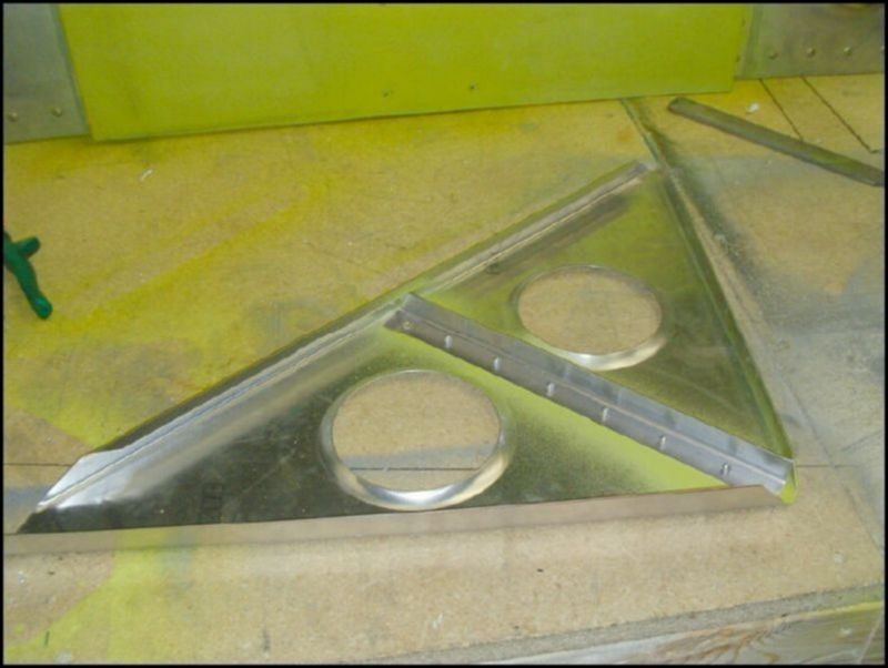 Deburr, clean, prime, and rivet the Ls to the bellcrank supports.