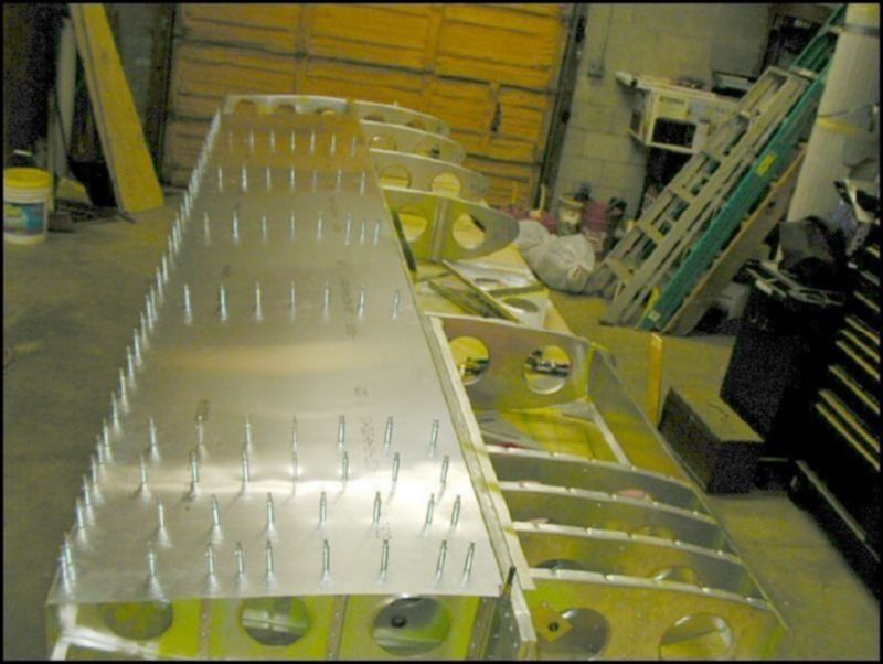 Drill and cleco the rear bottom wing skin.