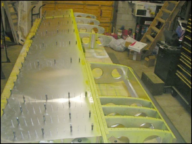 Rivet rear bottom wing skins.