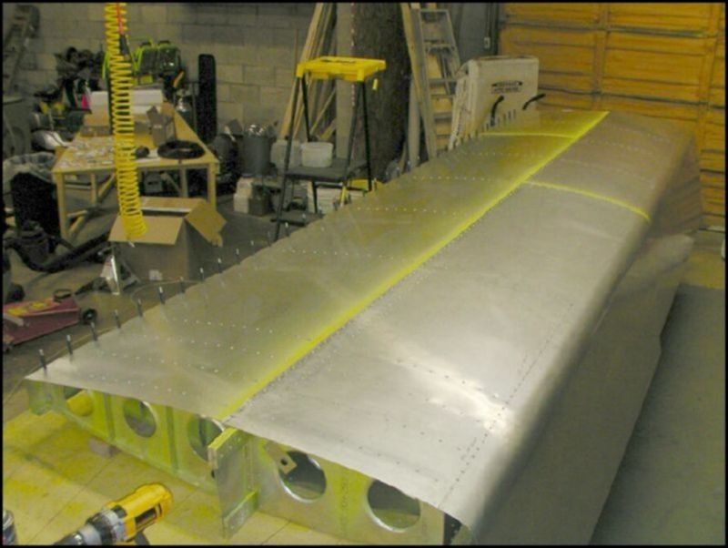 Rivet front bottom wing skins.