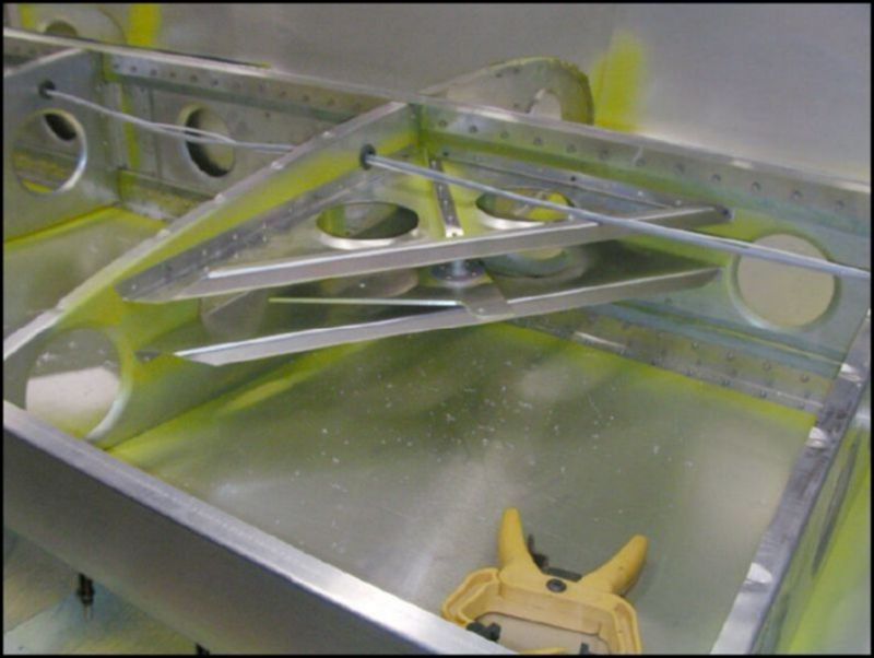 Position alieron bellcrank and alieron stop in rear of wing as per drawings.  Drill, cleco, deburr, clean, prime, and rivet.