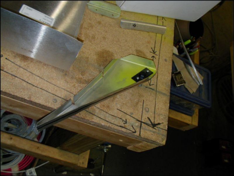 Another image of the aileron control rod bolt riveted to rib number one.