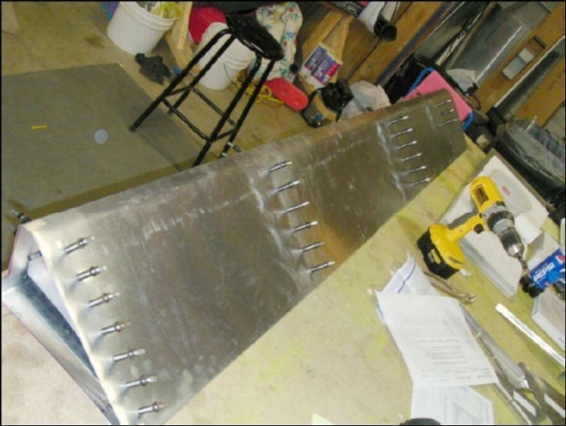 Position, drill, and coleco the four aileron ribs inside the aileron skin.