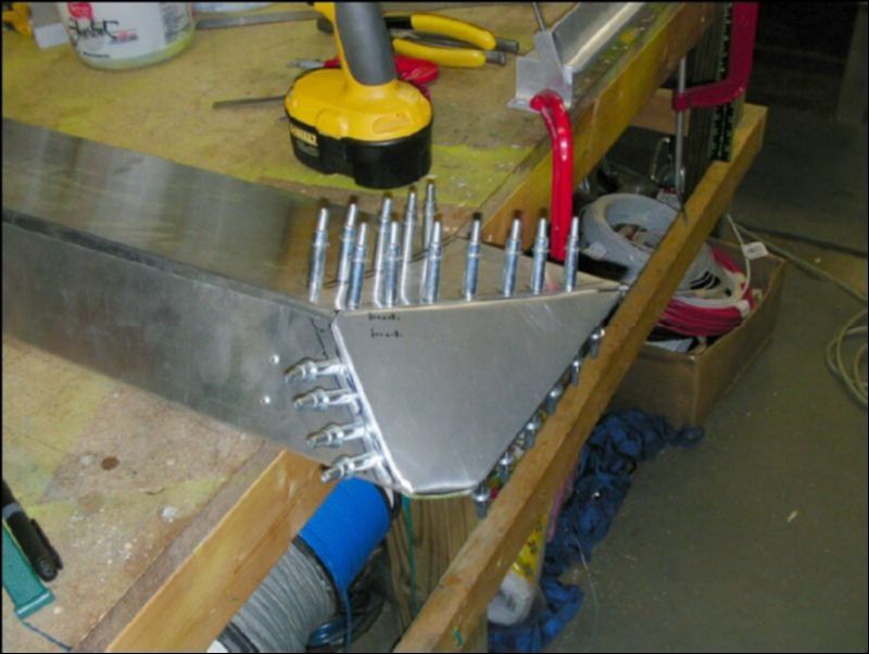 Another image of the aileron tip clecoed to the aileron.