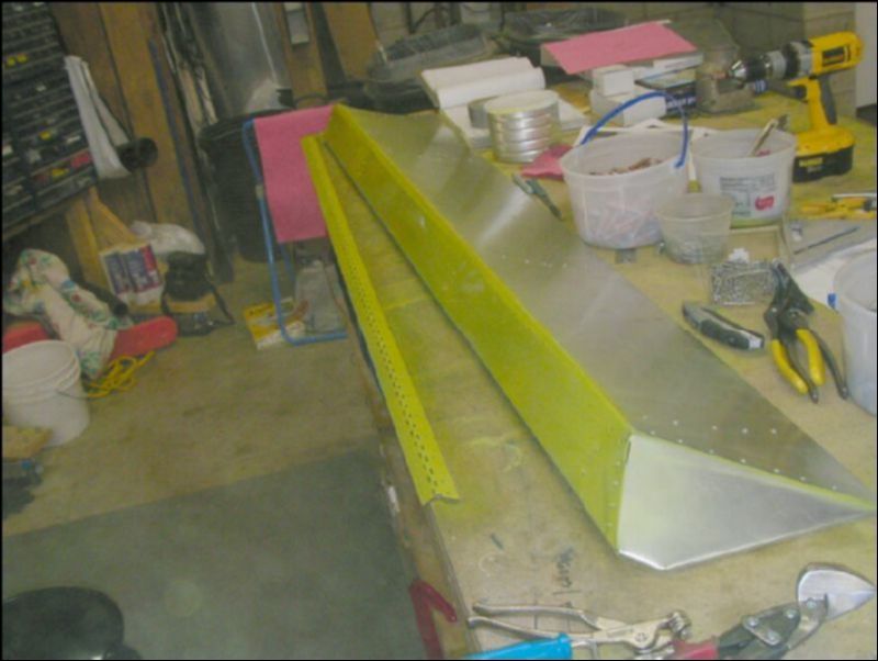 Deburr, clean, and prime the aileron hinge.