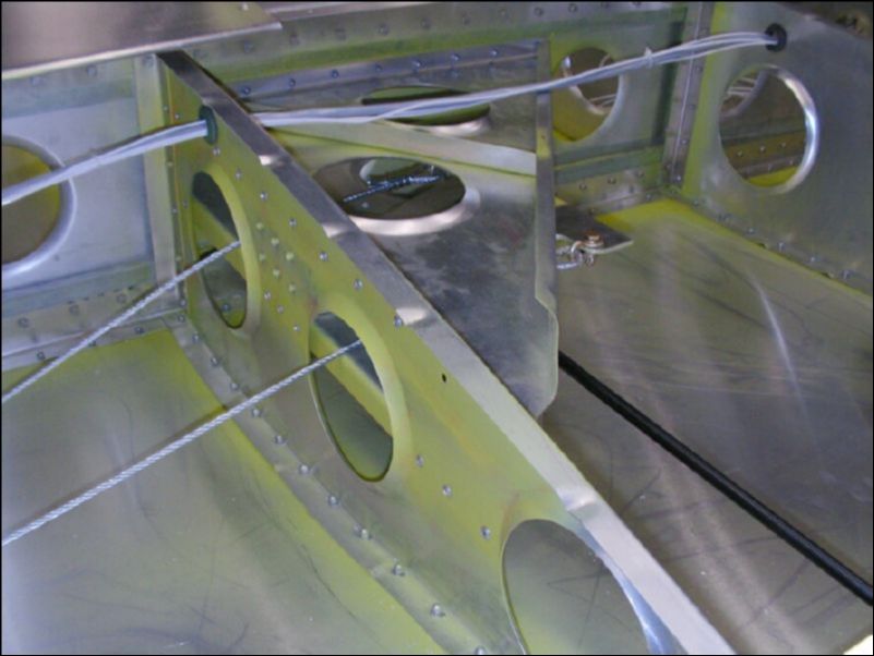 Connect aileron control cables to bellcrank.