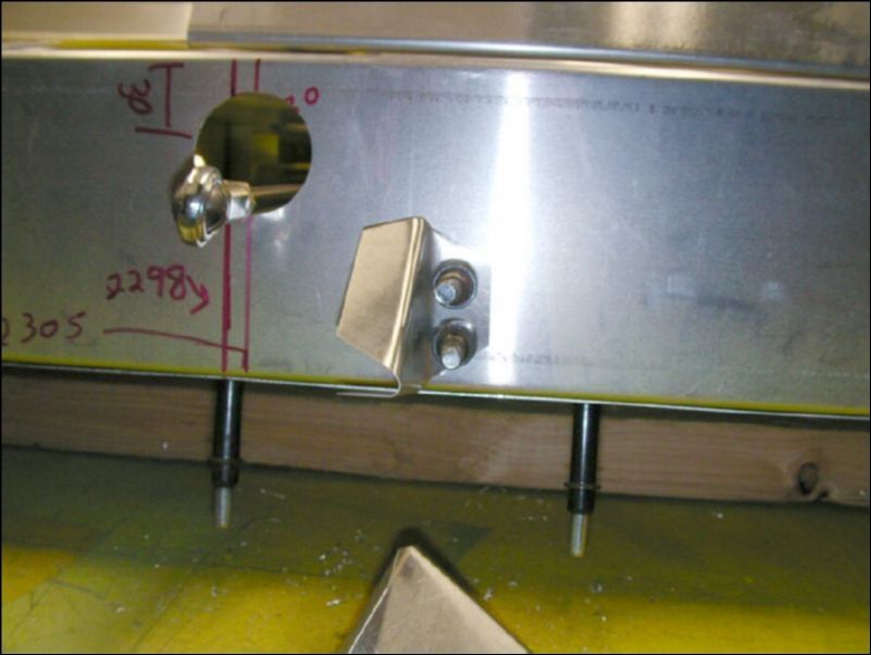 Drill and cleco the two aileron support gussets flush to the bottom of the rear channel.