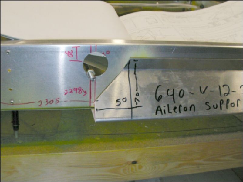 Mark and cut I.B. end of aileron support channel.  When this part is installed you will line the edge of it up at 2298 mm from the I.B. end of the wing.  This image shows it at 2305 but I correct this before drilling my rivet holes.