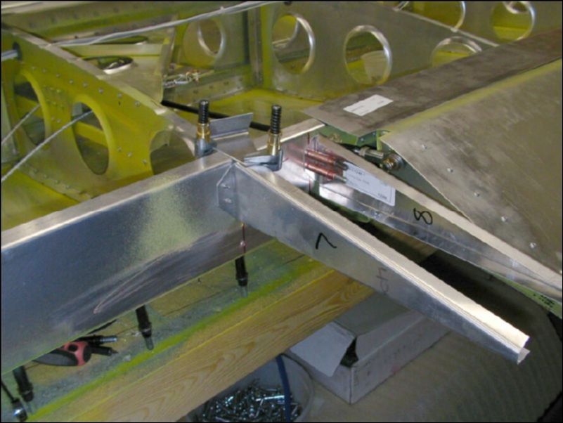 Drill and cleco the trailing edge riblets to the rear channel.  The top of each riblet is flush with the top of the rear channel.