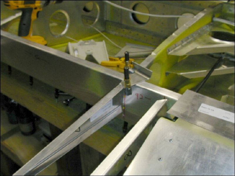 Drill and cleco the trailing edge riblets to the rear channel.  The top of each riblet is flush with the top of the rear channel.