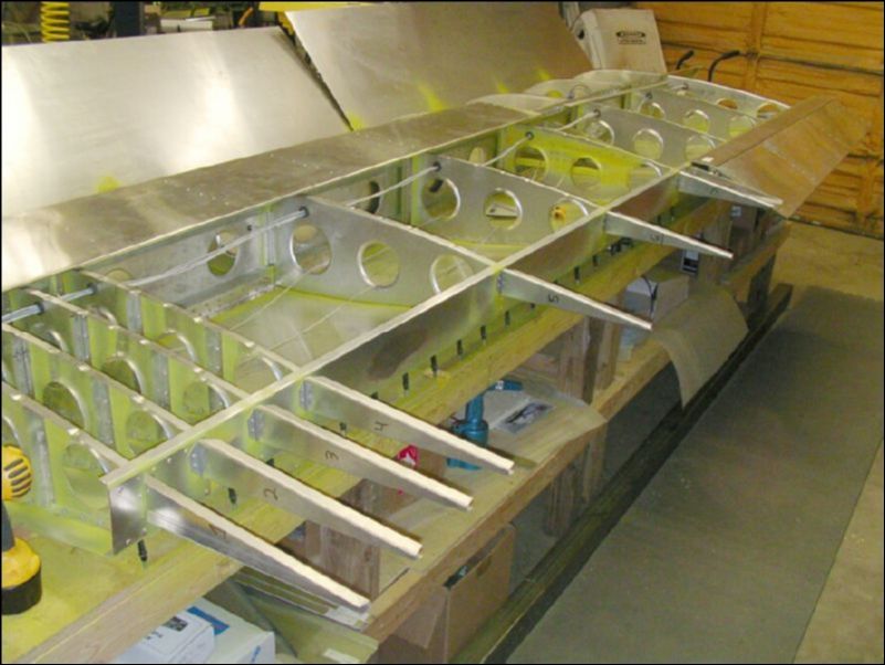 Rivet riblets to rear channel.