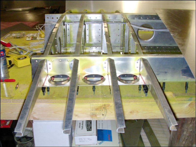 Drill and cleco inboard gusset to bottom of riblets.