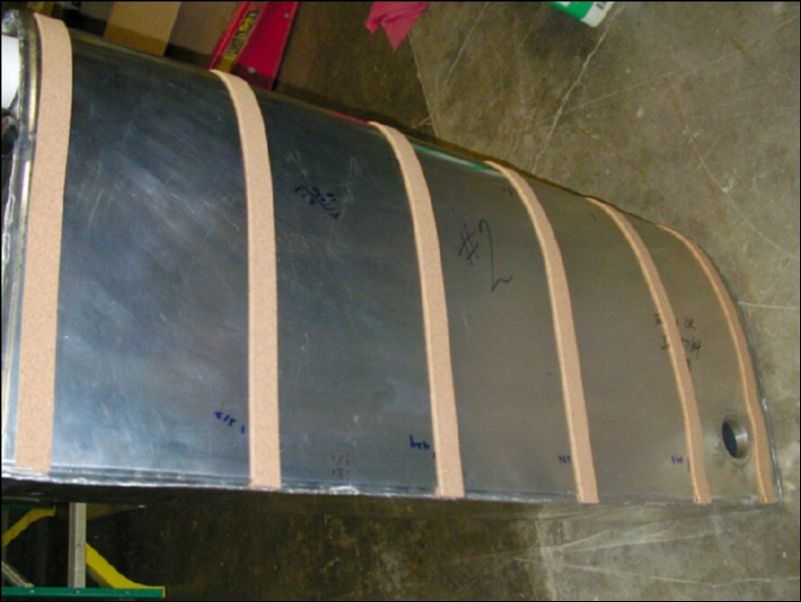 Install cork strips around fuel tank