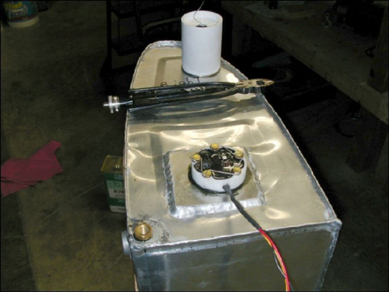 Install fuel level sender in fuel tank and safety wire bolts.