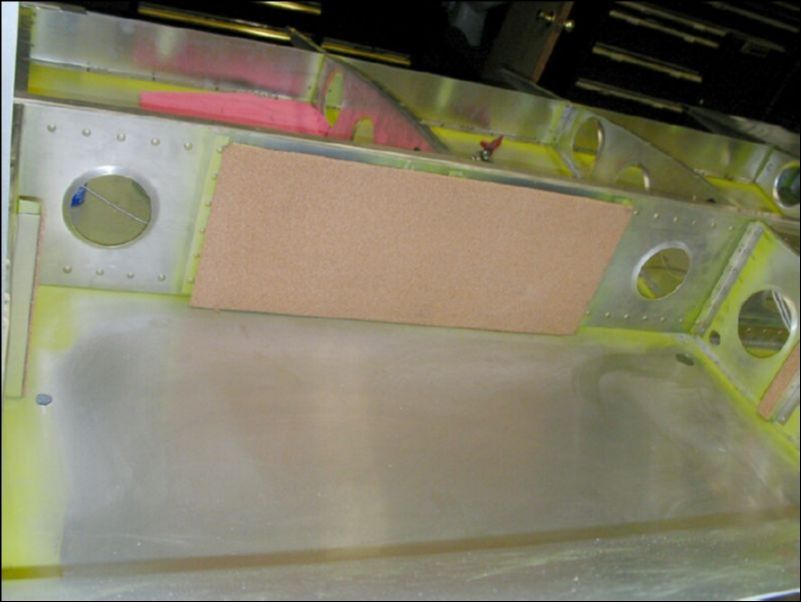 This image shows both the fuel tank drain hole and the fuel tank vent hole.