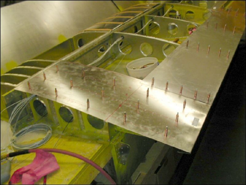 Drill and cleco the walk way skin.