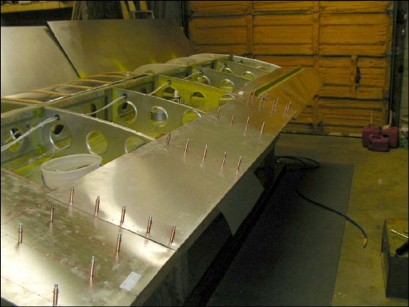 Drill and cleco the trailing edge skin.