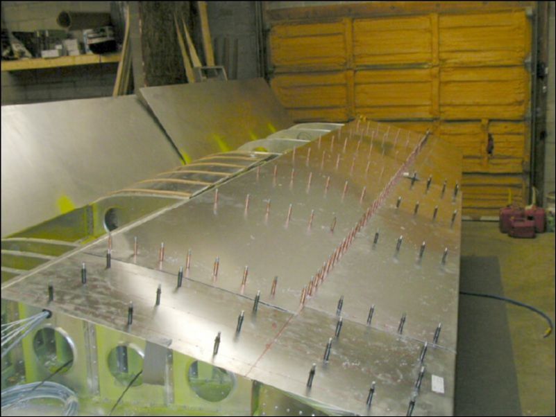 Drill and cleco the rest of the top rear skins but do not drill at the spar yet since the front skin will overlap that area.