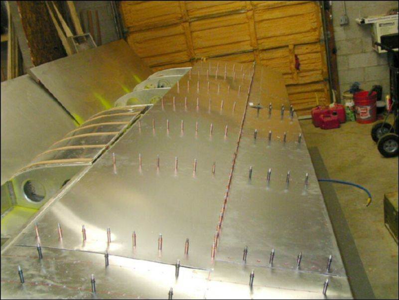 Drill and cleco the rest of the top rear skins but do not drill at the spar yet since the front skin will overlap that area.