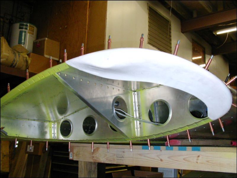 Deburr, clean, prime, and rivet the Ls to the wing tip.  NOTE:  Do not rivet to the top front skin yet.