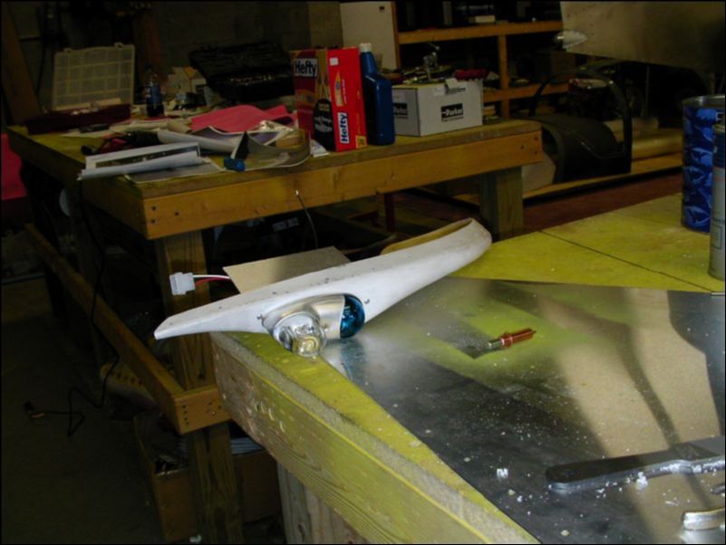 Install strobe light assembly in fiberglass wing tip.