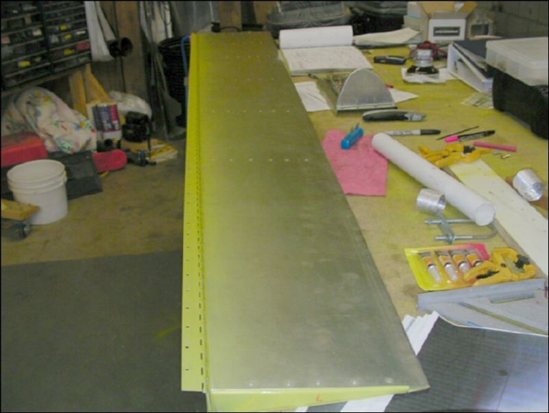 Deburr, clean, and prime flap hinge