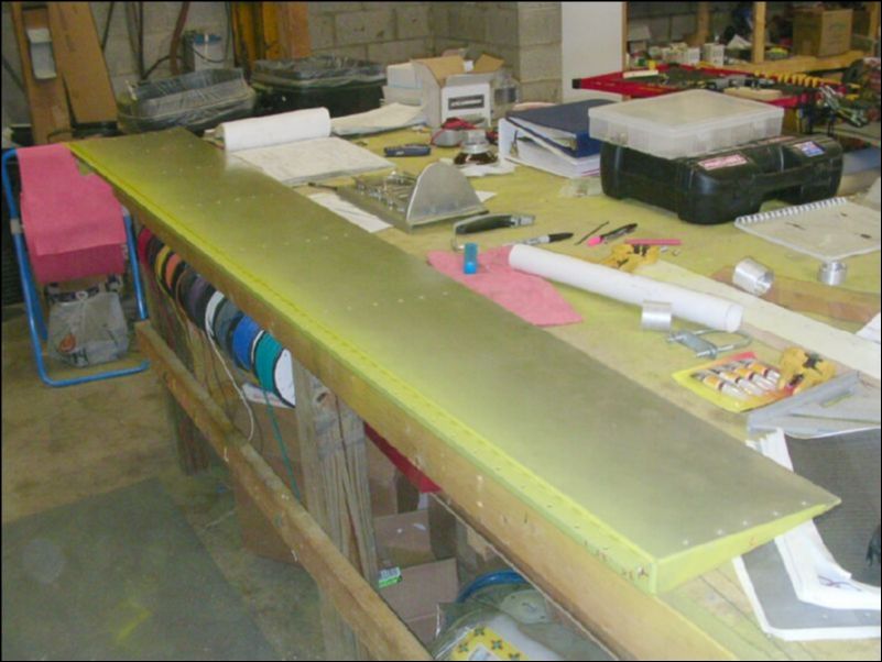 Deburr, clean, and prime flap hinge