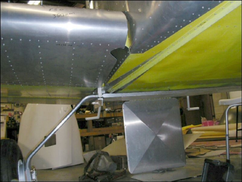 Finish trimming the right wing skin to fit the shape of the fuselage and to give access to the front and rear wing attachment areas.