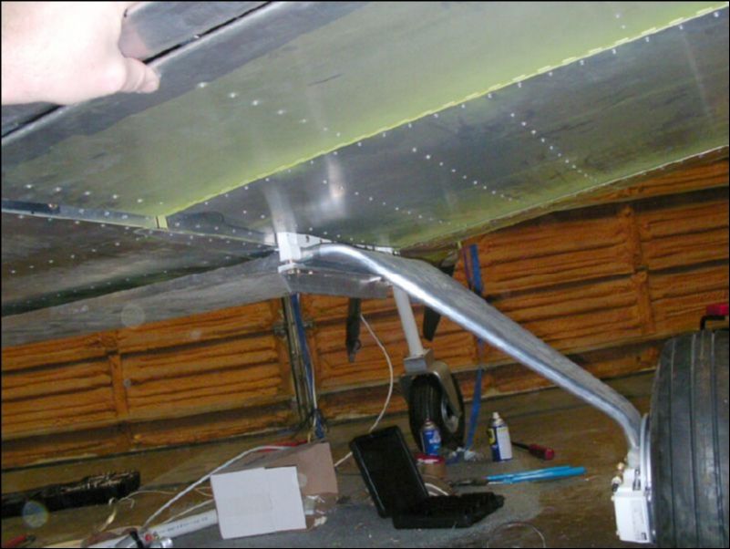 Finish trimming the right wing skin to fit the shape of the fuselage and to give access to the front and rear wing attachment areas.