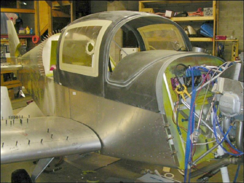 Right wing is finally bolted to the aircraft, now I can finish the top wing skins, install the fuel line, cut the access panel hole and petcock hole.